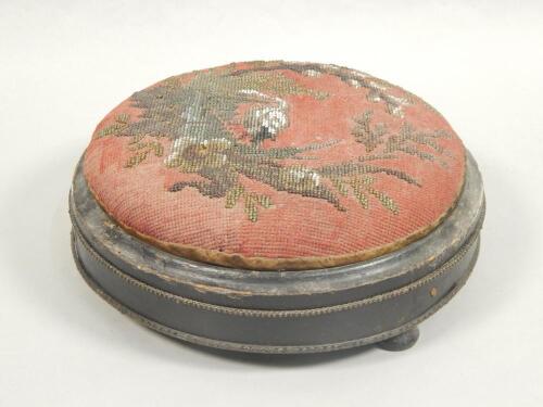 A Victorian ebonised and gilt metal foot stool