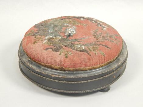 A Victorian ebonised and gilt metal foot stool