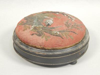 A Victorian ebonised and gilt metal foot stool