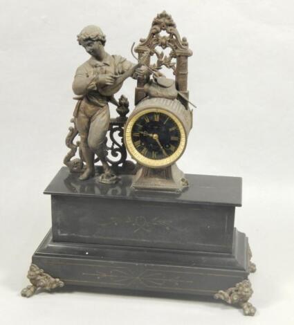 A black marble and gilt spelter figural mantle clock