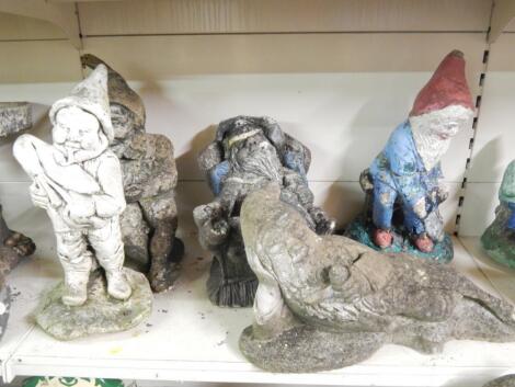 A collection of five composition garden gnomes