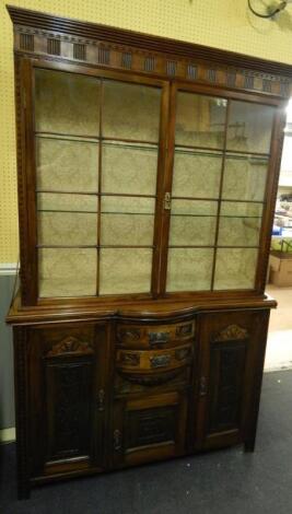 A walnut display cabinet