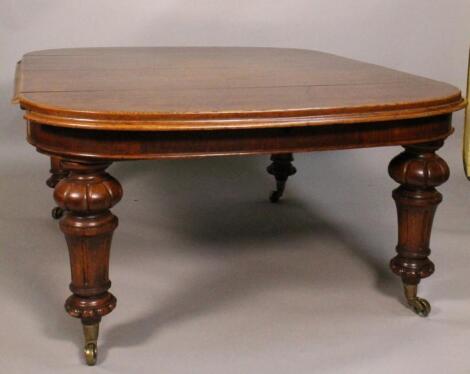 A Victorian oak extending dining table