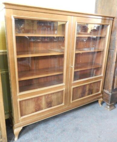 A French walnut display cabinet