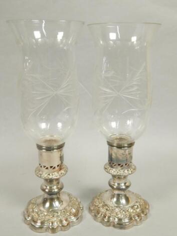 A pair of modern cut glass and silver plated storm lanterns