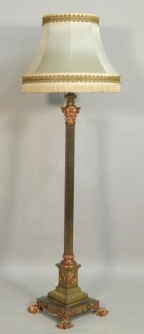 A late 19th/early 20thC brass and copper effect column standard lamp