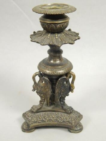 A mid 19thC bronze candlestick