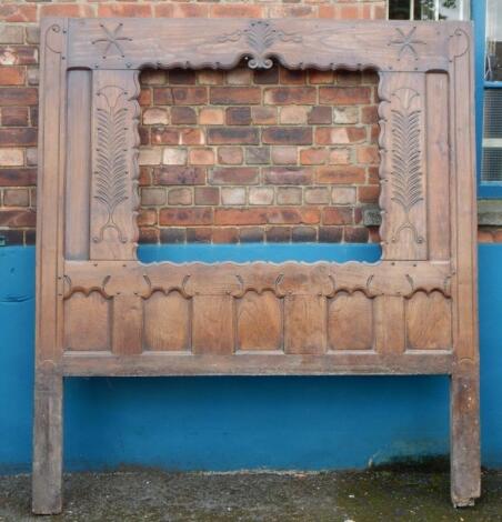 A late 18th/early 19thC French oak bed head