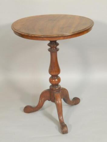 A Victorian figure mahogany tripod table