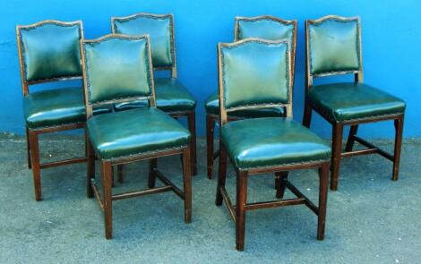 A set of six mahogany board room type chairs