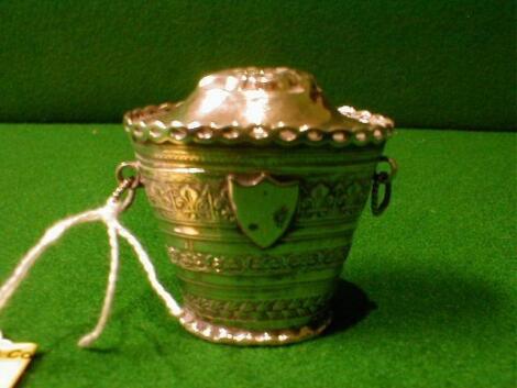 An early 20thC Dutch silver box in the form of a tapering bucket with 2 loop handles