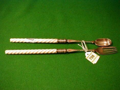 A pairing of Victorian silver pickle fork and spoon with ivory twist handles