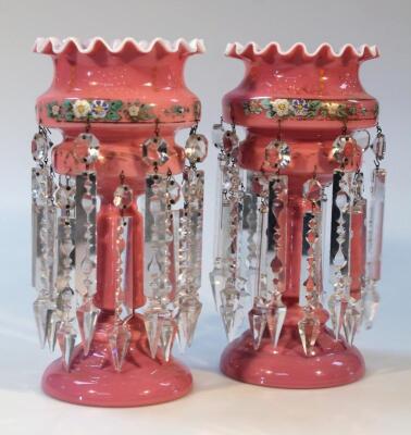 A pair of late Victorian pink glass lustres