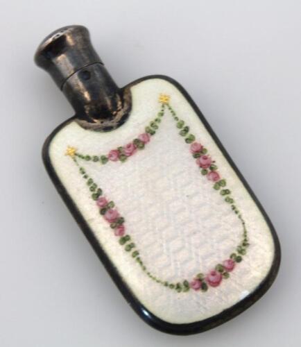 An early 20thC enamel and white perfume bottle