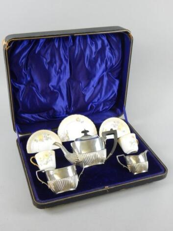 A Edwardian silver and porcelain bachelor's tea set