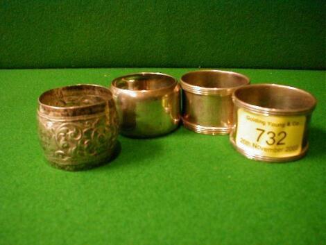 A pair of silver napkin rings and 2 others