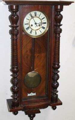 A late 19thC walnut cased Vienna wall clock