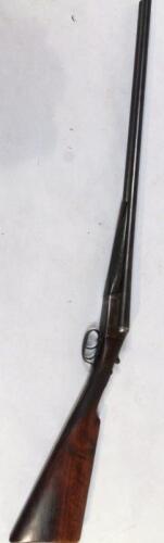 A Victoria 12 bore side by side shotgun