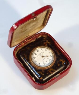 An early 20thC tortoiseshell and gilt metal travel clock