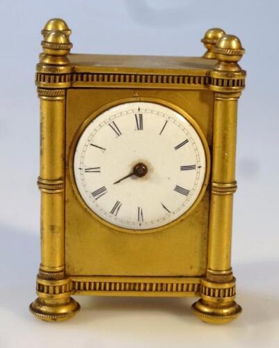 A late 19thC gilt metal travel clock