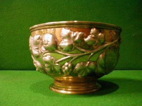 A Victorian silver bowl with vine repousse decoration