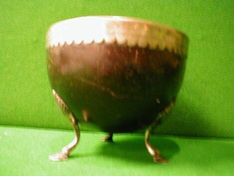 An early 18thC silver mounted coconut bowl on 3 stepped feet