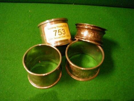 A pair of Victorian silver napkin rings and 2 others