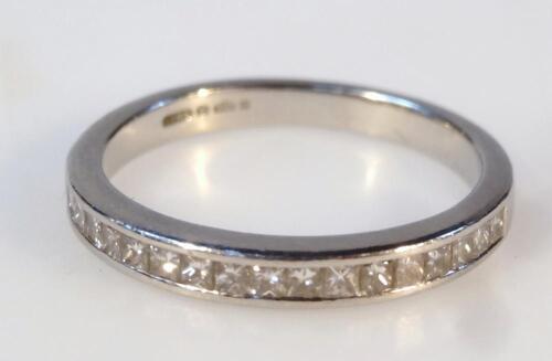 A ladies platinum and diamond half eternity ring