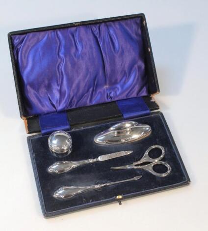 A George V silver travelling manicure set