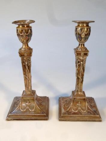 A pair of 19thC Old Sheffield plate candlesticks