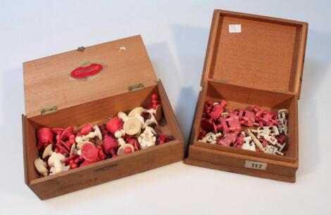 A Chinese carved chess set in white and red pieces