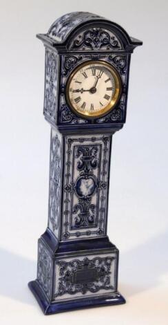 A 20thC earthenware miniature longcase clock