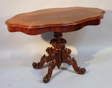 A flame mahogany finish occasional table