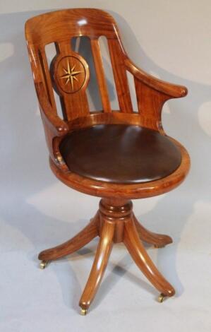 A Starbay African rosewood swivel office chair