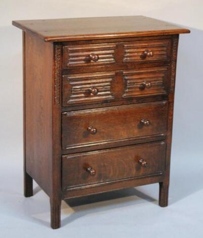 A 20thC oak finish Ercol style side cabinet