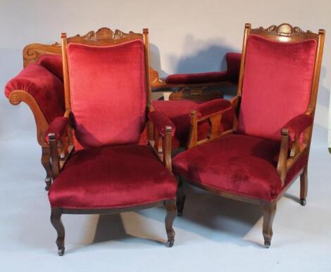 A late Victorian/early Edwardian walnut framed three piece lounge suite