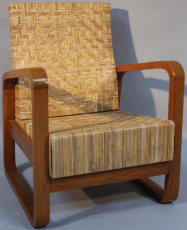 A 20thC retro design light wood armchair