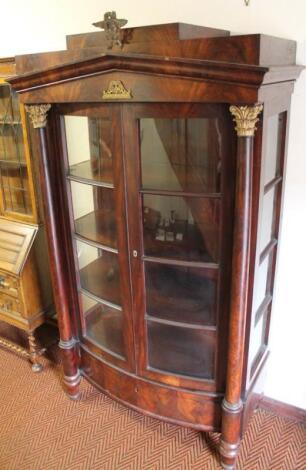 A 19thC continental flame mahogany display cabinet