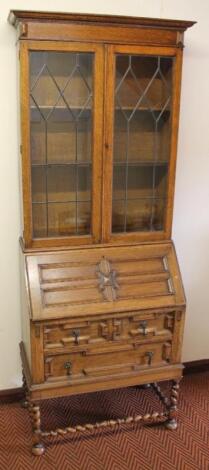 A 20thC oak bureau bookcase