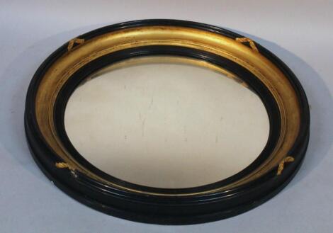 A 19thC gilt wood and ebonised portal mirror