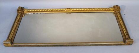 A 19thC gilt wood oval mantel mirror