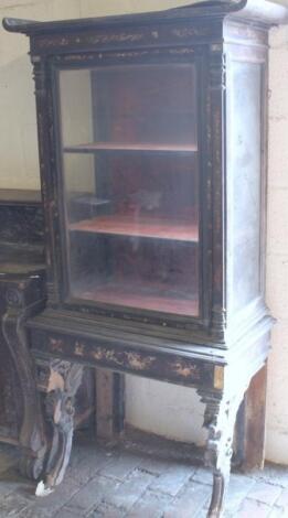 A 19thC Peret of Paris display cabinet on stand with an upped fixed moulded cornice above a glazed d