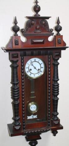 A late 19thC/early 20thC walnut mahogany and ebonised Vienna wall clock