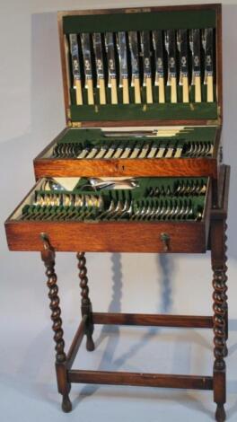 An oak cased freestanding canteen of Superior Sheffield plated cutlery