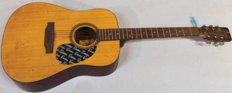 An Encore W255 acoustic guitar