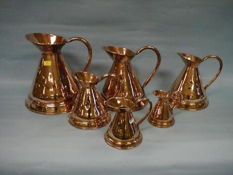 A set of six Victorian copper graduated jug measures