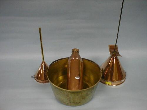 A copper and brass funnel