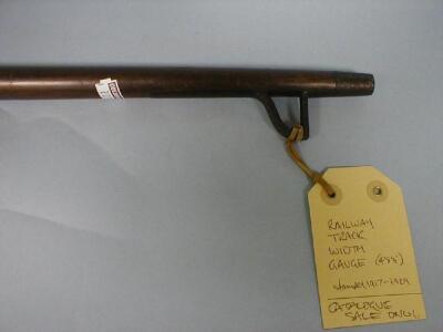 An early 20thC stained wood railway track gauge