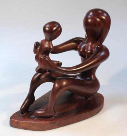 A polished hardwood figure of a female nude