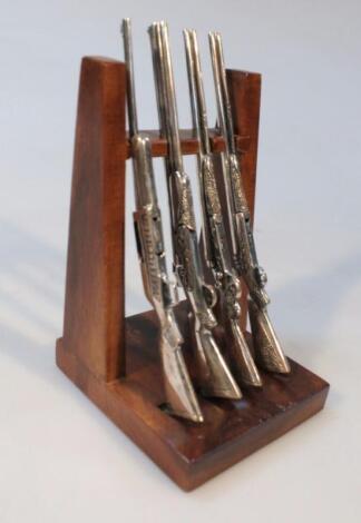 A set of four 20thC miniature guns